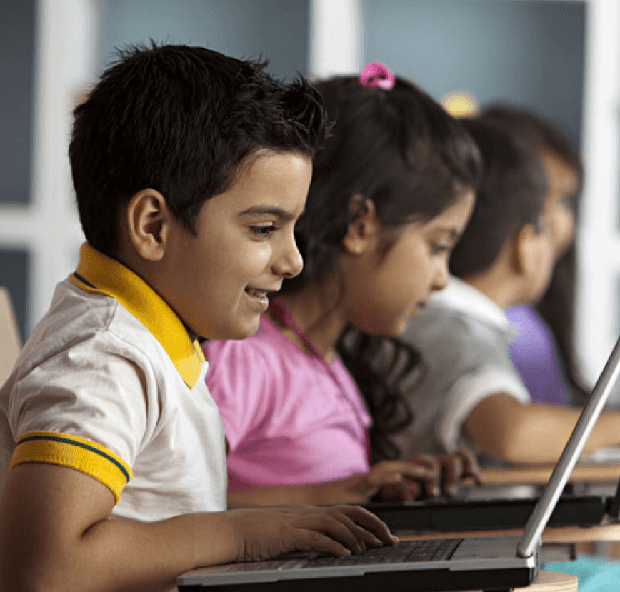 Two children looking at a digital tree with STEAM education icons